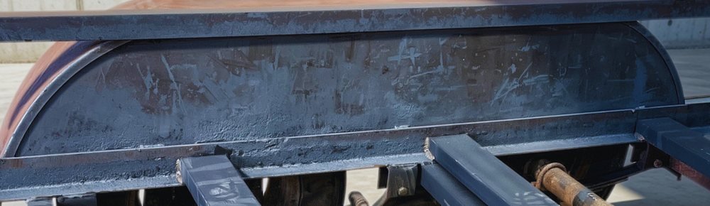 The same flatbed trailer fender after laser cleaning, rust and paint removed down to bare metal